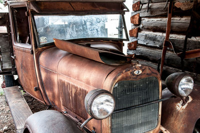 Old abandoned car parked in garage