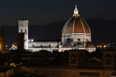 View of illuminated building against sky at night