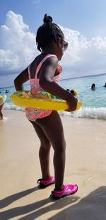 Rear view of woman on beach