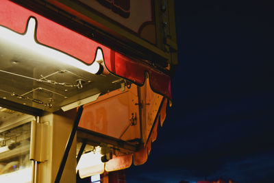 Low angle view of illuminated light against clear sky at night