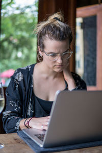 Young woman working using laptop