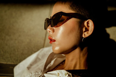 Portrait of young woman wearing sunglasses