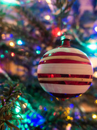 Close-up of illuminated christmas decorations on tree