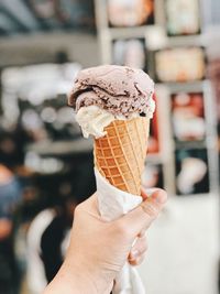 Hand holding ice cream cone