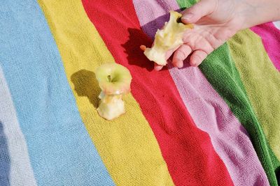 High angle view of woman holding apple core