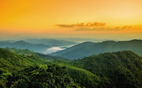 Scenic view of mountains against sky during sunset