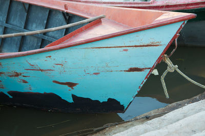 Rusty boat anchored off shore