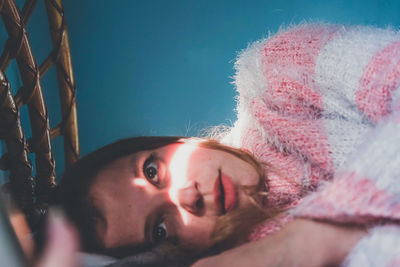 Close-up portrait of young woman looking away