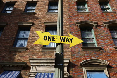 Low angle view of sign against building