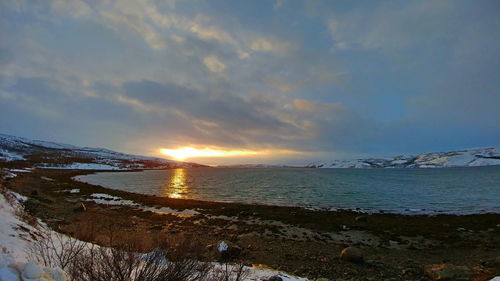 Scenic view of sea against sky during sunset