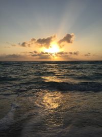 View of calm beach at sunset