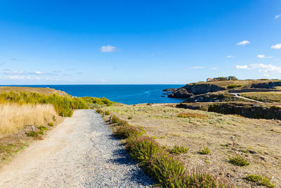 Scenic view of sea against blue sky