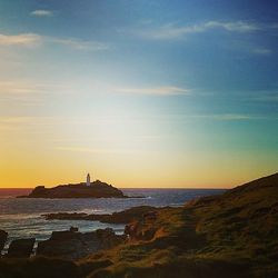 Scenic view of sea at sunset