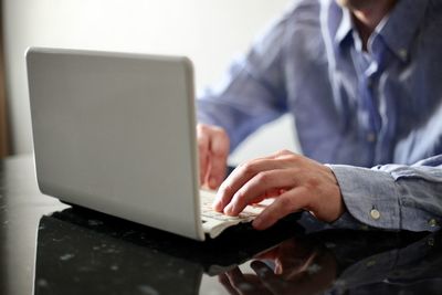 Man using laptop on table