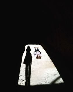 High angle view of girl lying on field in cave