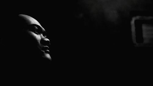 Portrait of man in darkroom