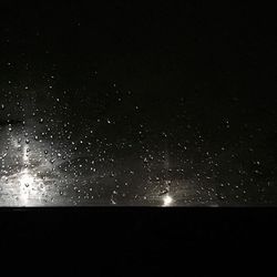 Scenic view of landscape against sky at night