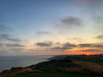 Scenic view of sea against sky during sunset