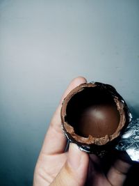 Close-up of hand holding chocolate egg