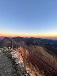 Scenic view of landscape against clear sky during sunset