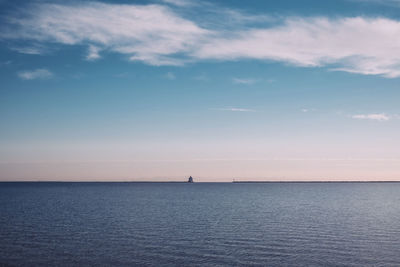 Scenic view of sea against cloudy sky