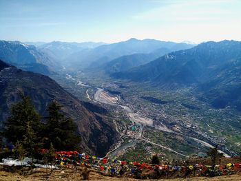 Group of people on mountain range against sky