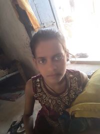 Portrait of smiling woman at home