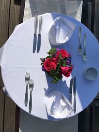 High angle view of rose bouquet on white table