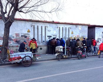 Bicycles parked by built structure