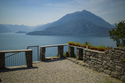 Scenic view of sea and mountains against sky