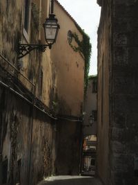 Street amidst buildings against sky