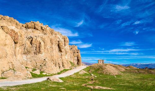 Rock formations on landscape against sky