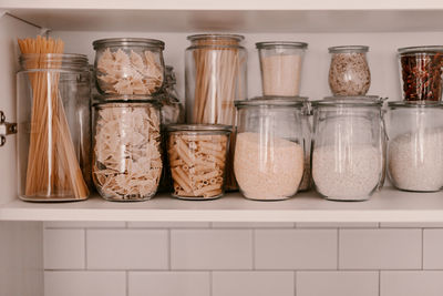 Close-up of jars in glass jar