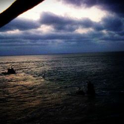 Scenic view of sea against cloudy sky