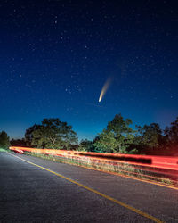 Road against sky at night