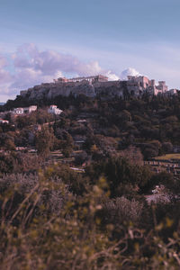 View of buildings in city against sky