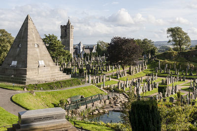 View of cemetery against cloudy sky