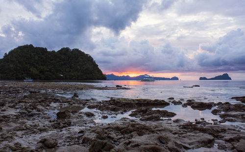 Scenic view of sea against sky at sunset