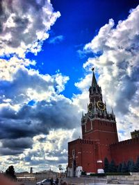 Low angle view of building against cloudy sky