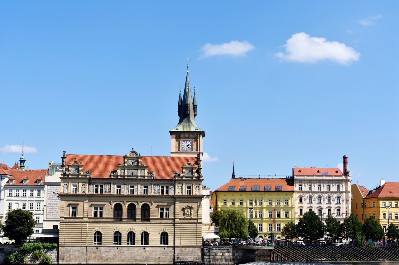 BUILDINGS IN CITY AGAINST BLUE SKY