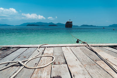 View of pier in sea against sky