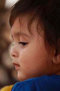 Side face portrait of a cute baby boy