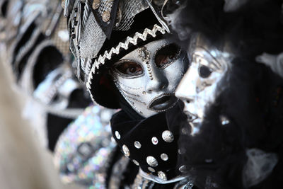 Portrait of woman wearing costume and mask