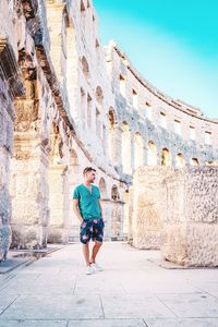 Full length of man standing at coliseum