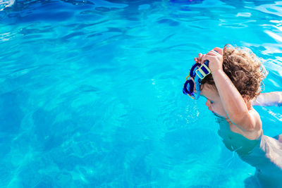 High angle view of woman swimming in pool