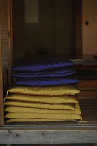 Stack of cushions on floor at house