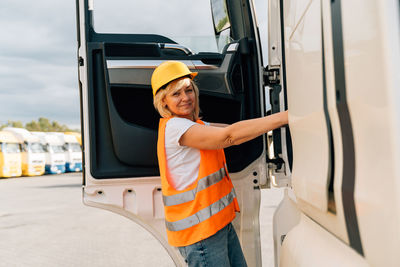 Portrait of driver by semi truck