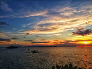 Scenic view of sea against orange sky