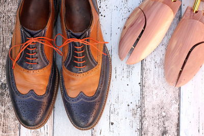 Directly above view of leather shoes on floorboard