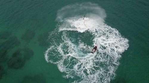 High angle view of person surfing in sea